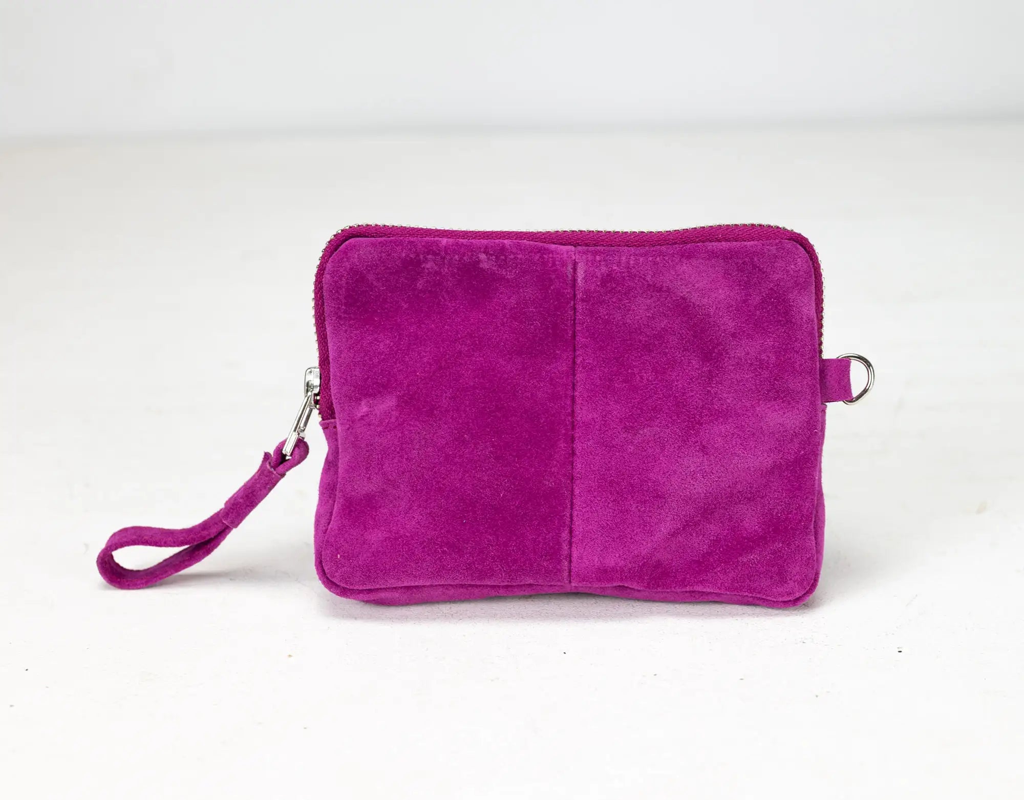 Purple suede clutch bag on a white background