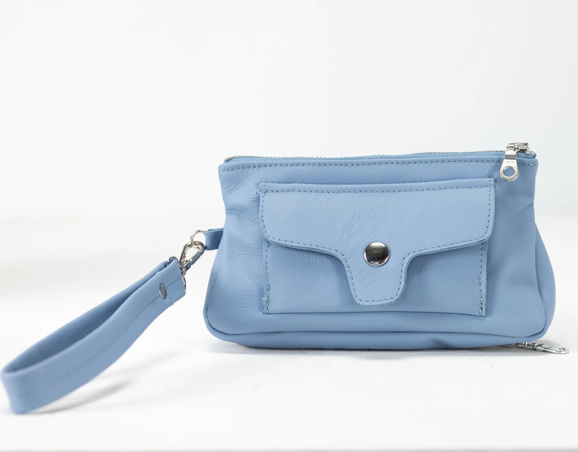 Light blue handbag with a strap on a white background