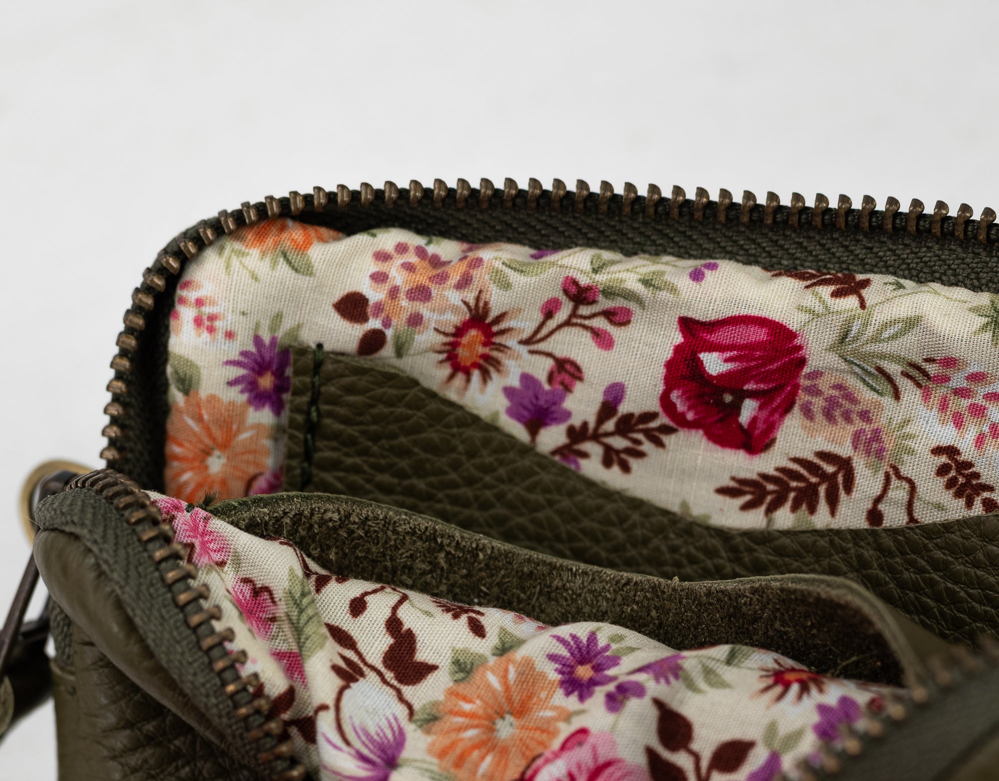 Floral-patterned fabric inside a bag with a white background