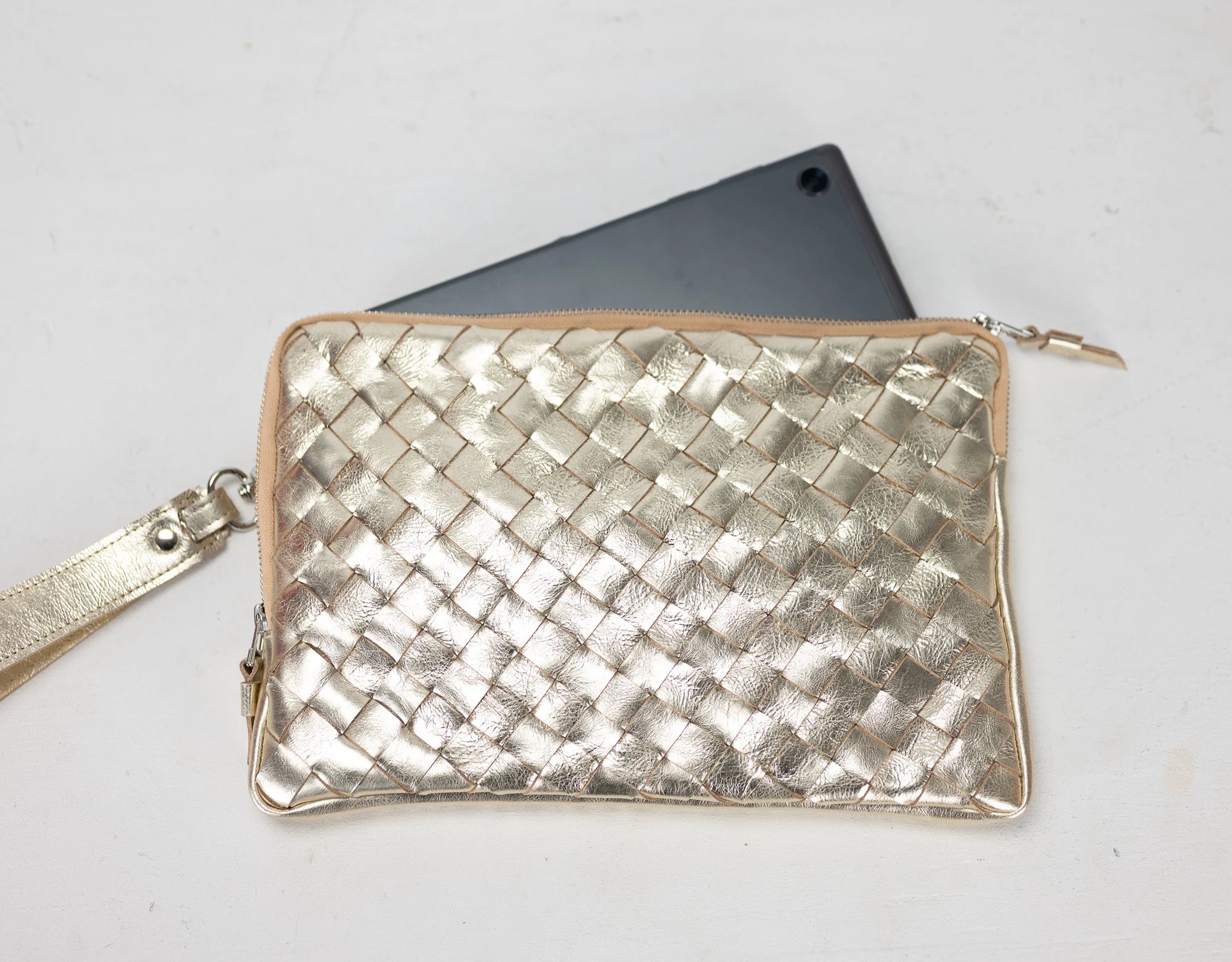 Yellow Gold woven clutch bag on a white background