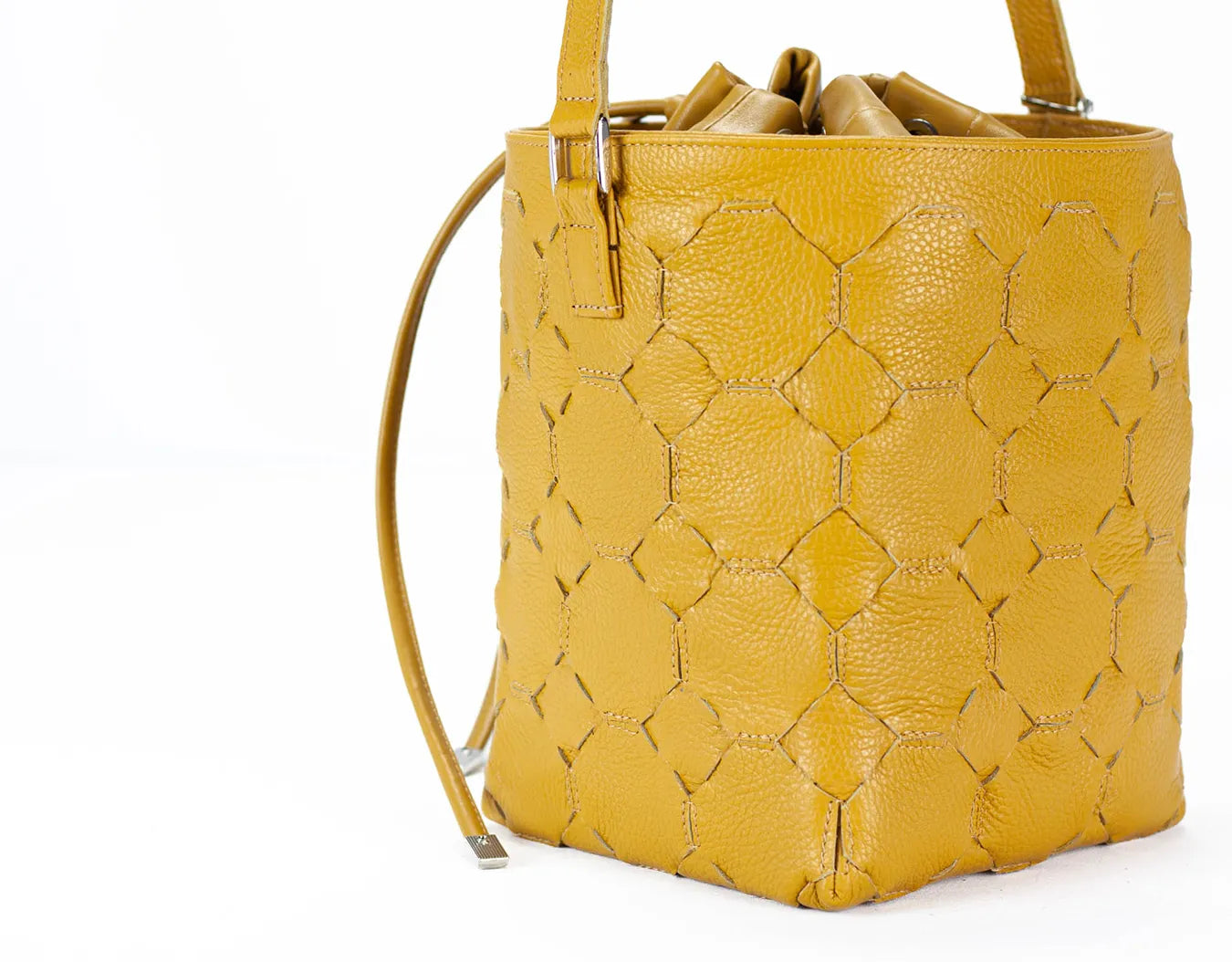 Yellow textured handbag on a white background