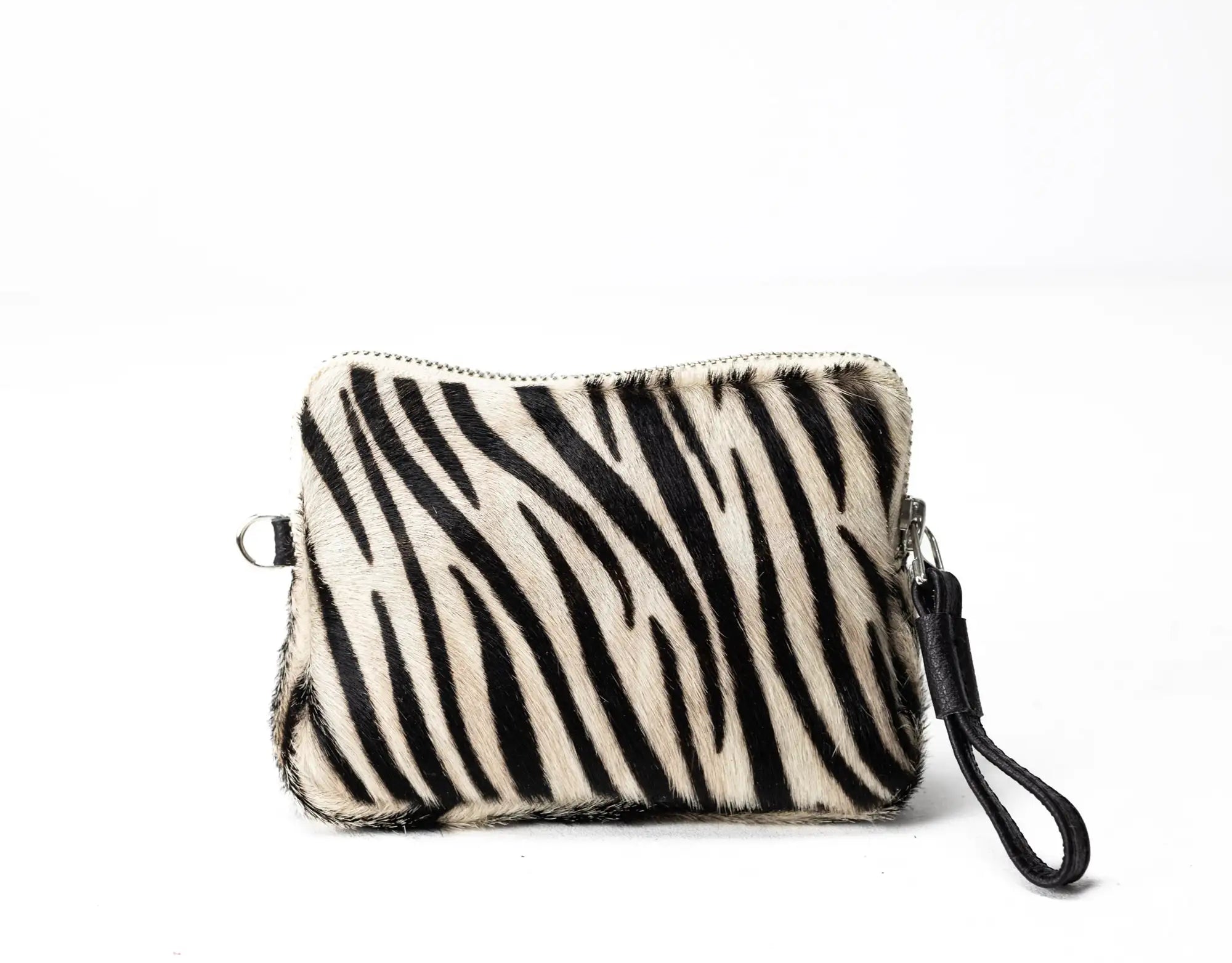 Zebra patterned pouch with a strap on a white background