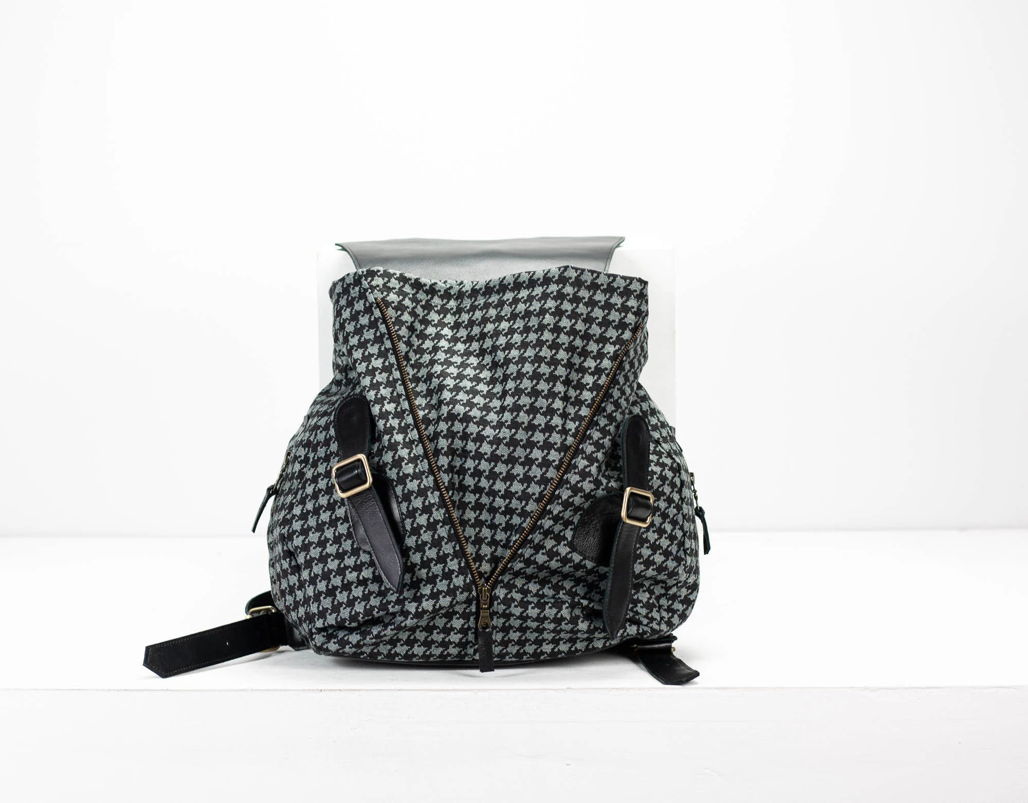 Houndstooth pattern backpack on a white background