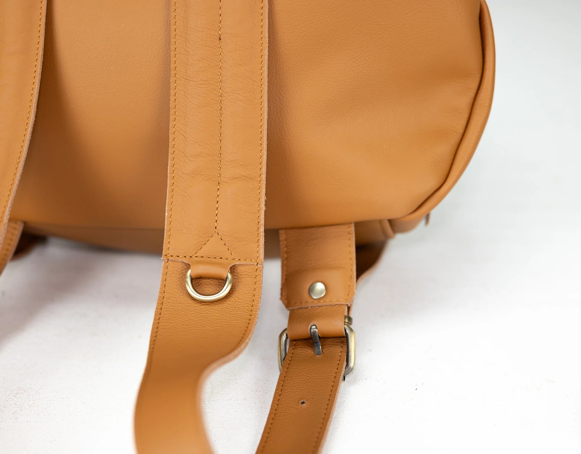 Brown leather backpack with adjustable straps