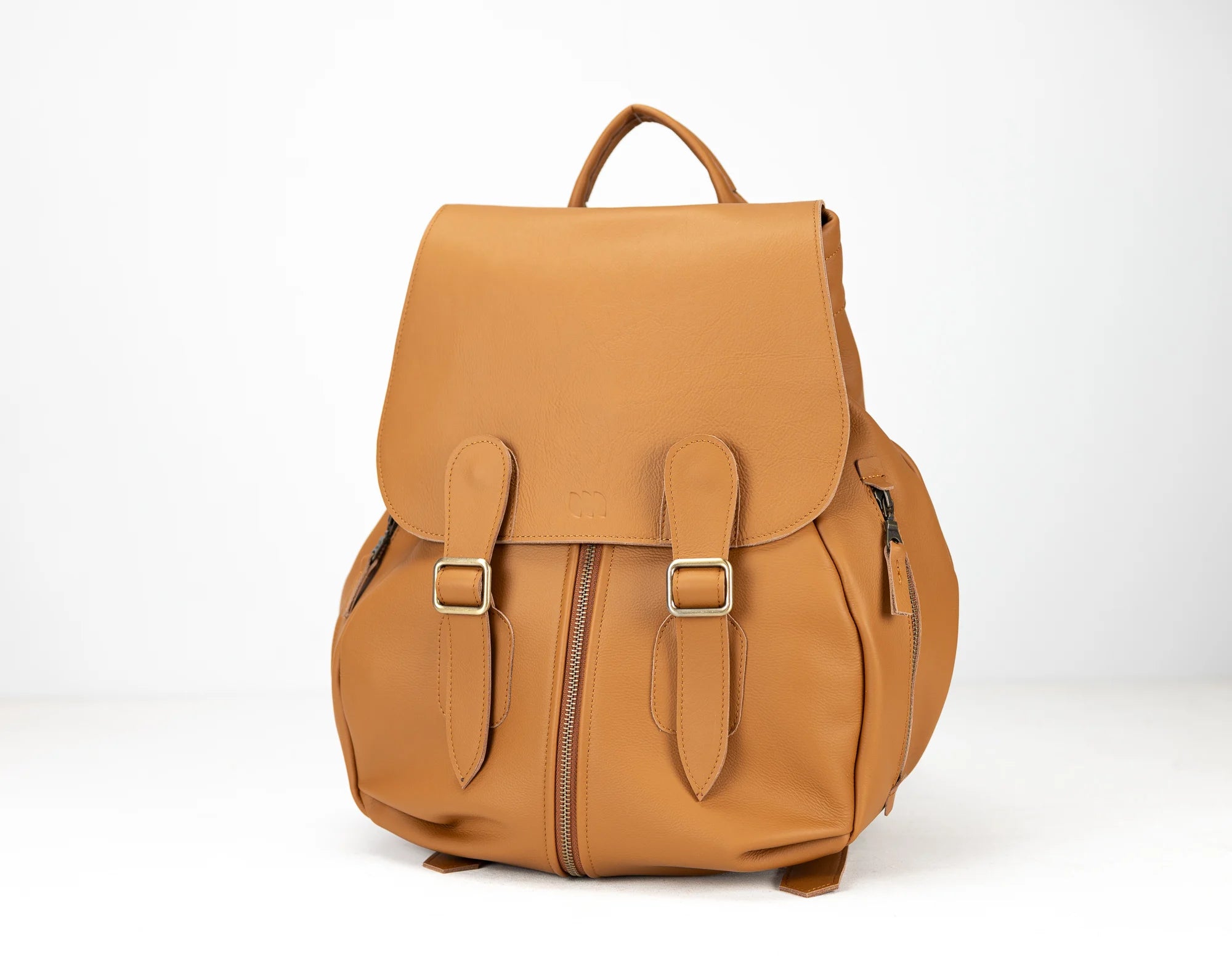 Tan backpack on a white background