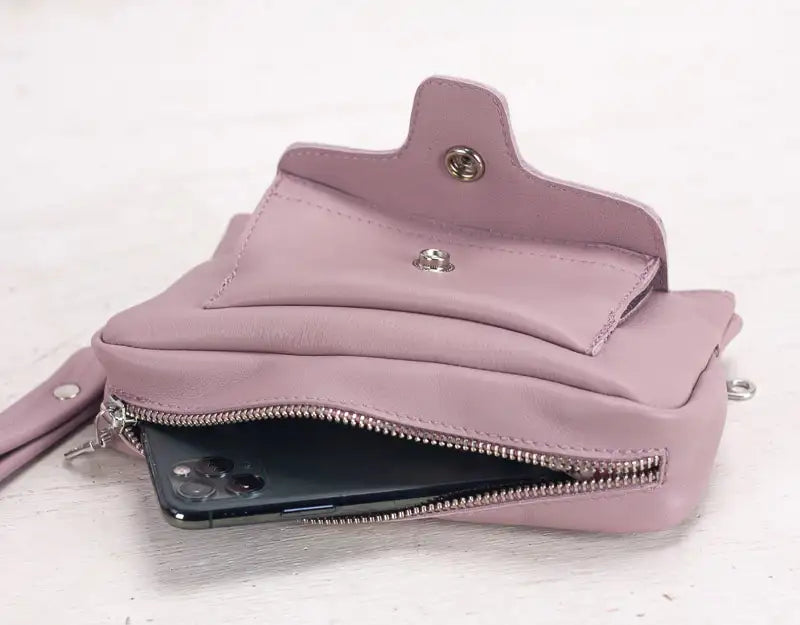 Pink wallet with a zipper on a white background
