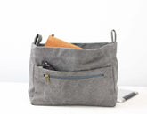 Gray fabric bag with a zipper pocket on a white background