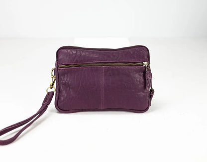 Purple leather clutch bag with a strap on a white background