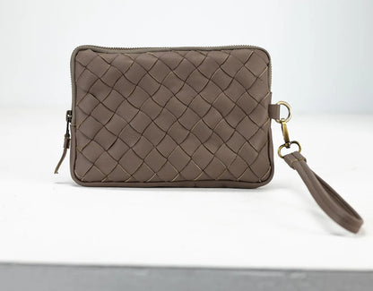 Brown woven clutch bag with a strap on a white background