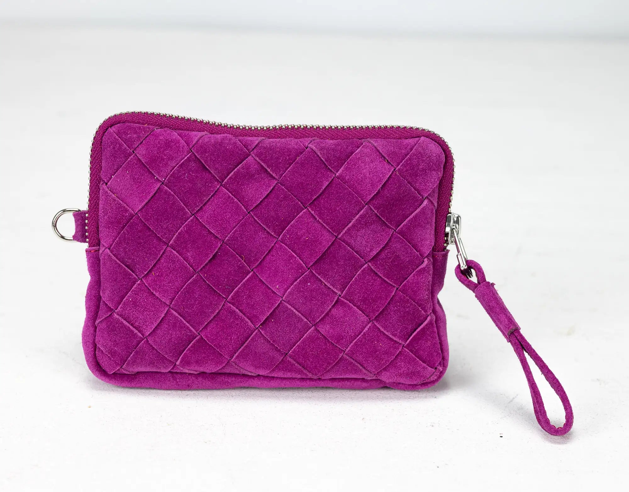 Purple woven clutch bag with a wrist strap on a white background