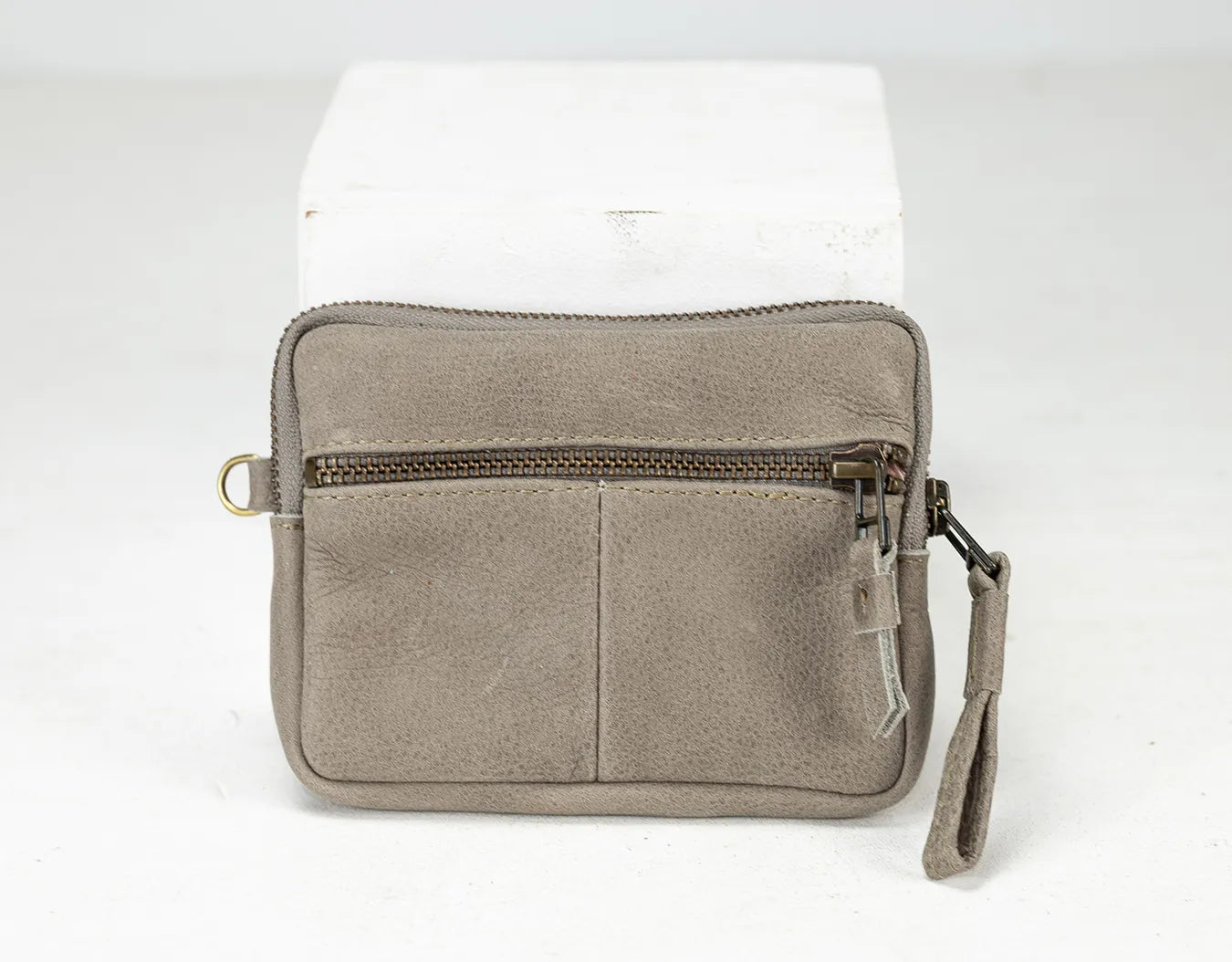 Grey pouch with a zipper on a white background