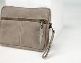 Grey pouch with a zipper on a white background