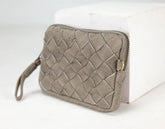 Quilted beige wallet on a white background