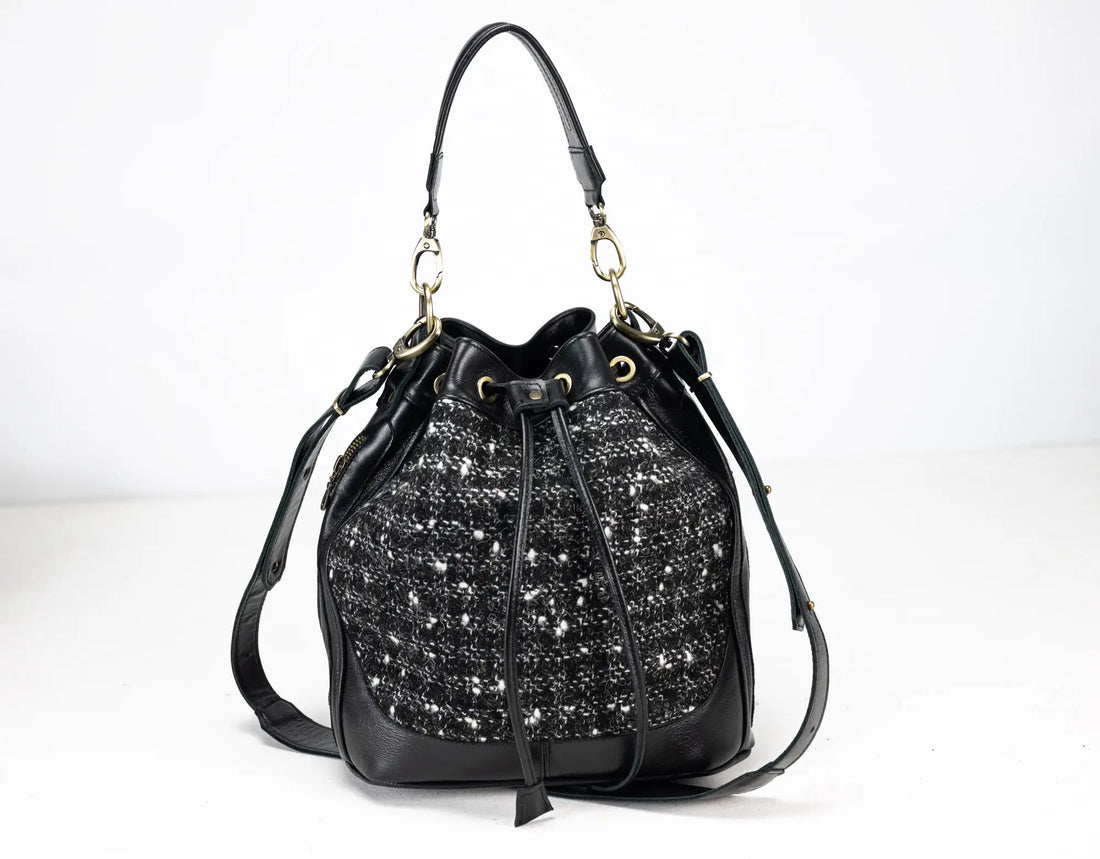 Black handbag with sparkling pattern on a white background