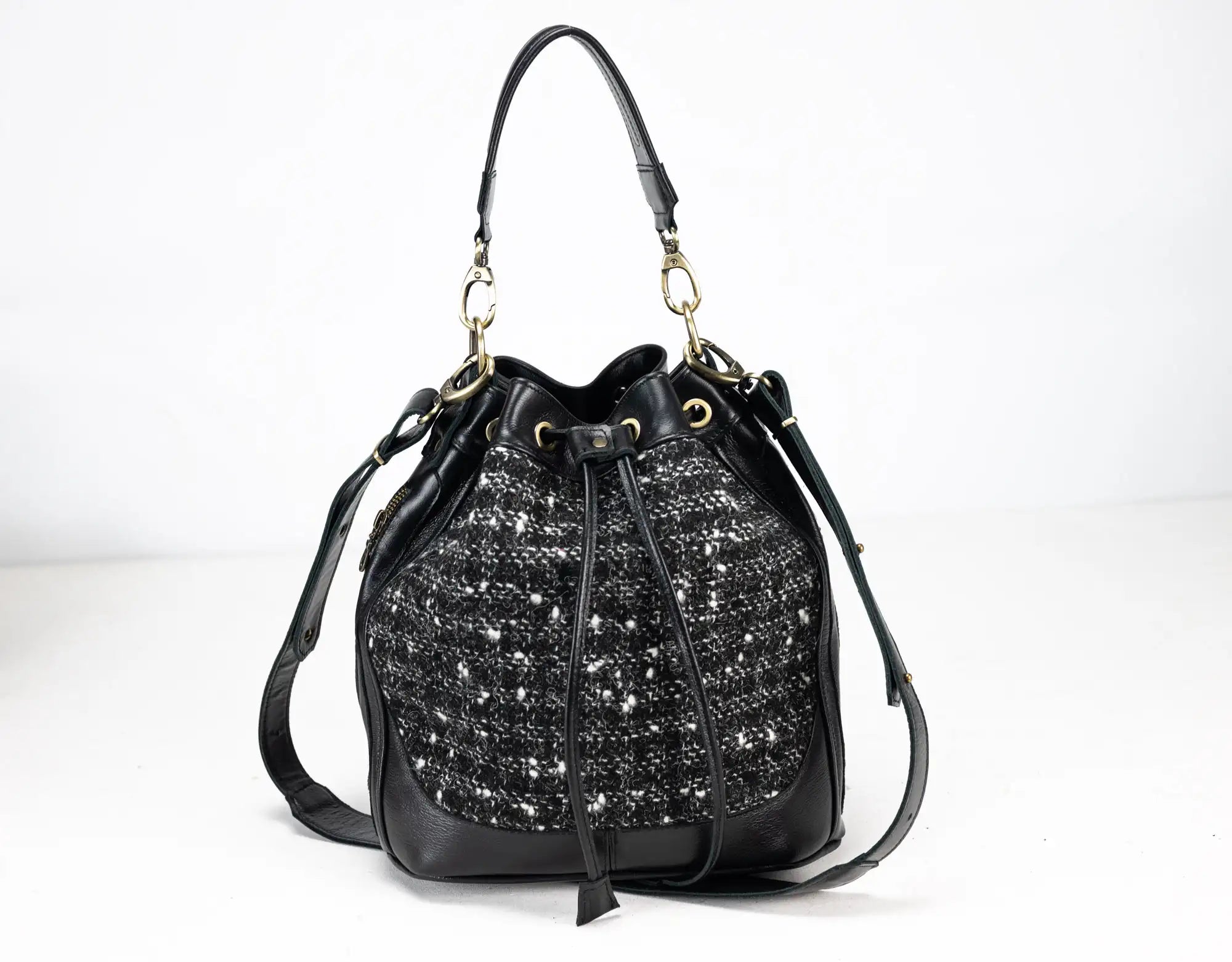 Black handbag with sparkling pattern on a white background