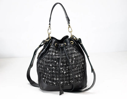 Black handbag with sparkling pattern on a white background