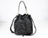Black handbag with sparkling pattern on a white background