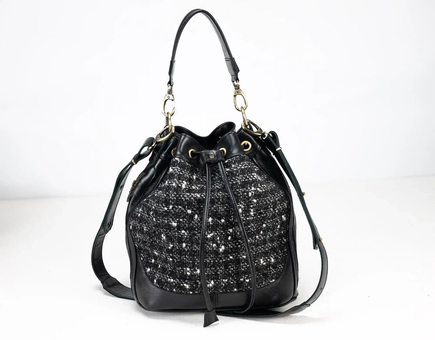 Black drawstring bag with sparkling pattern on a white background