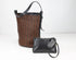Woven basket and black leather clutch on a white background