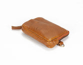 Brown leather pouch on a white background