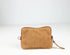 Brown leather clutch bag on a white background