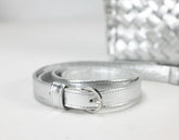 Silver belt on a light gray background