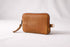Brown leather wallet with a zipper tassel