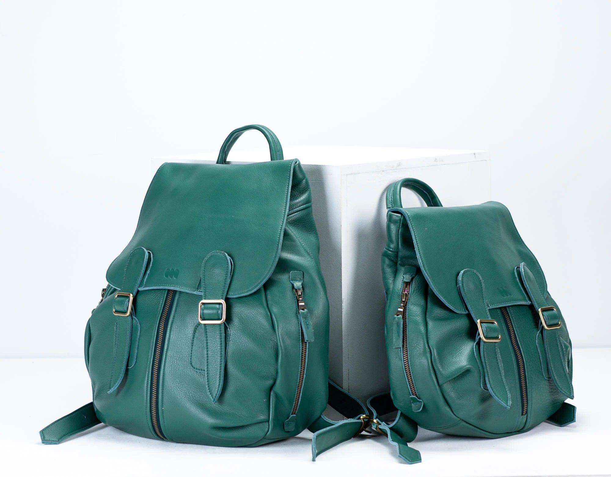 Petrol Green leather backpack in two sizes