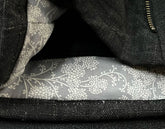 Close-up of a black bag with floral-patterned lining