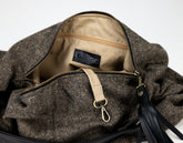 Brown textured bag with a visible brand label on a white background