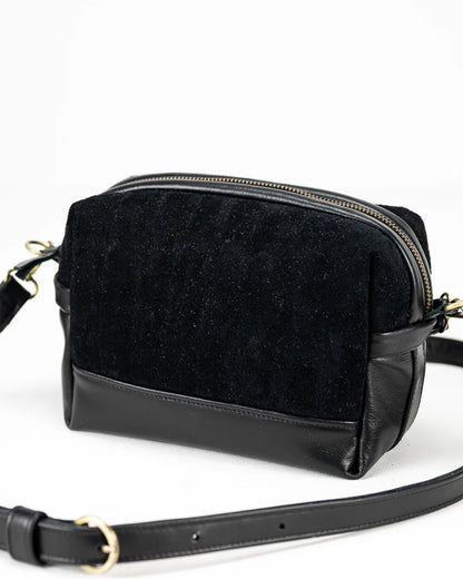 Black crossbody bag on a white background