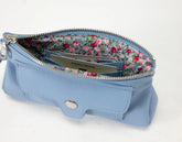 Blue pouch with floral interior on a white background