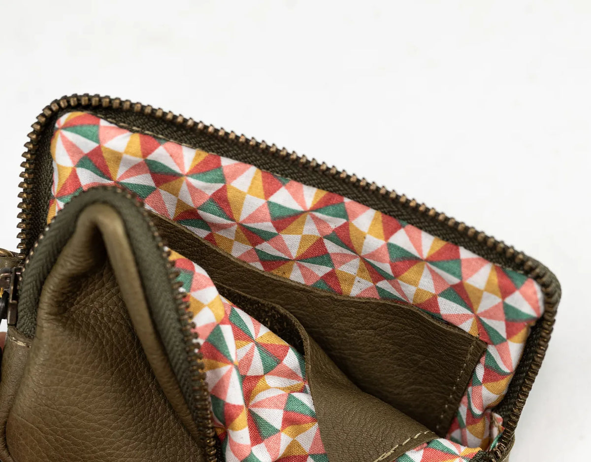 Brown leather wallet with geometric patterned interior on a white background#color_olive-green