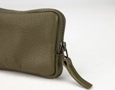 Green leather wallet with a zipper on a white background