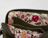 Floral-patterned fabric inside a bag with a white background