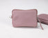 Pink pouch with a strap on a white background