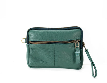 Green leather wristlet with a zipper on a white background