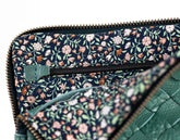Floral patterned clutch bag with green accents