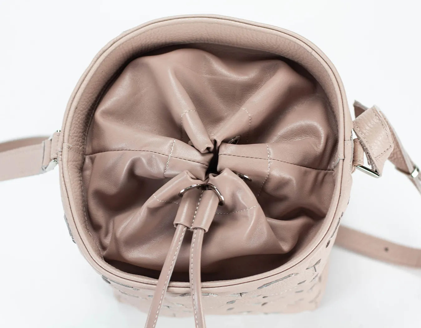 Beige handbag with a bow detail on a white background