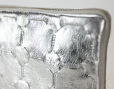 Close-up of a silver metal object with textured surface