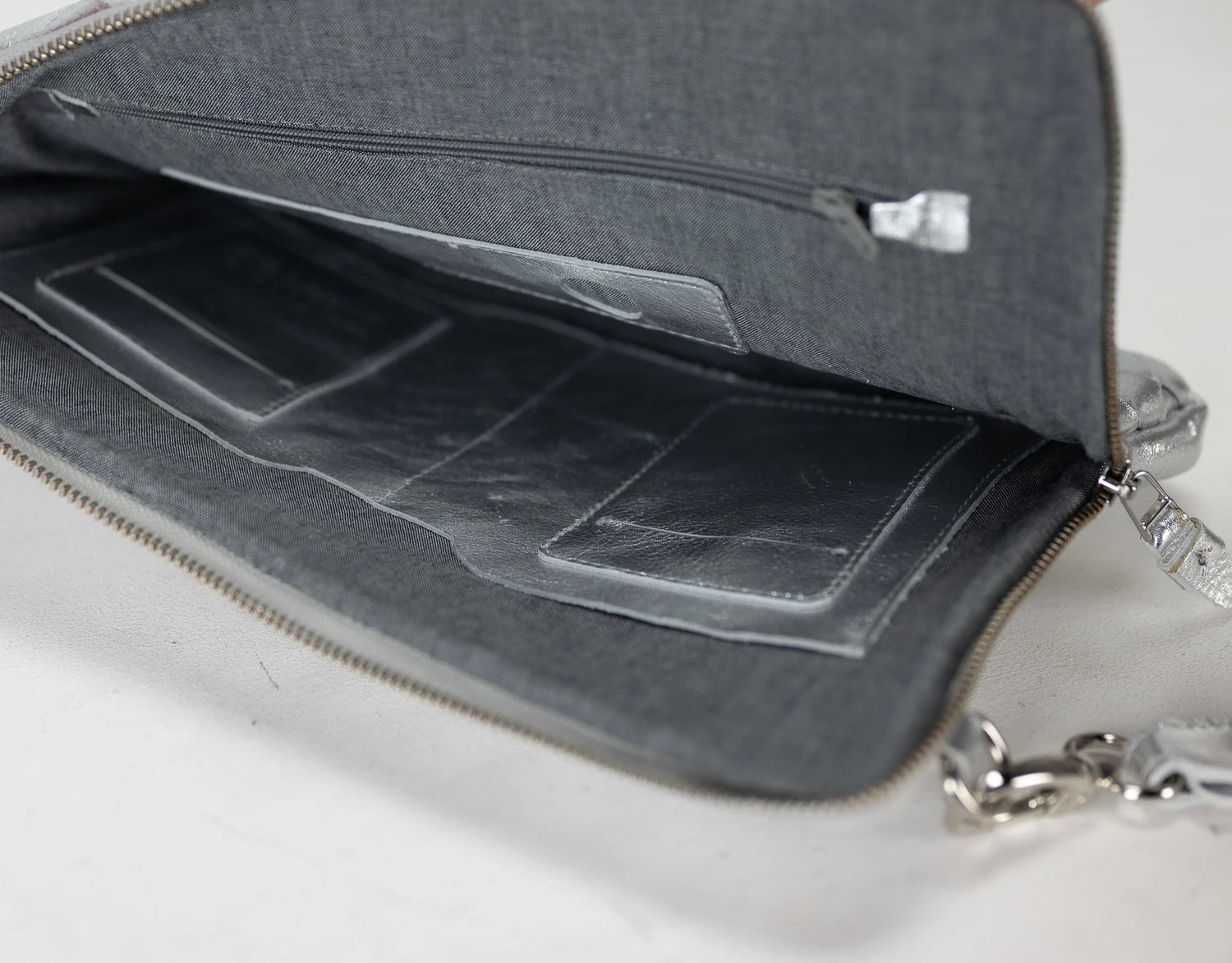 Gray bag with a compartmentalized interior on a white background