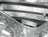 Close-up of a silver metallic handbag 