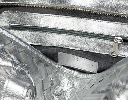 Close-up of a silver metallic handbag 
