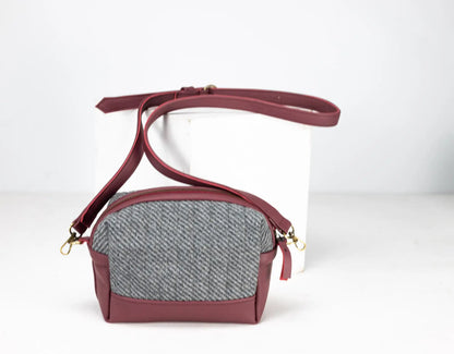 Maroon crossbody bag with a gray textured section
