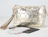 Yellow gold quilted clutch bag with a phone and cards on a white background