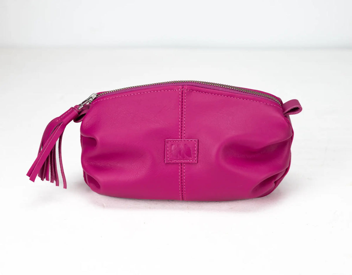 Pink pouch with a tassel on a white background#color_deep-pink