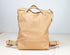 Beige leather backpack on a light gray background