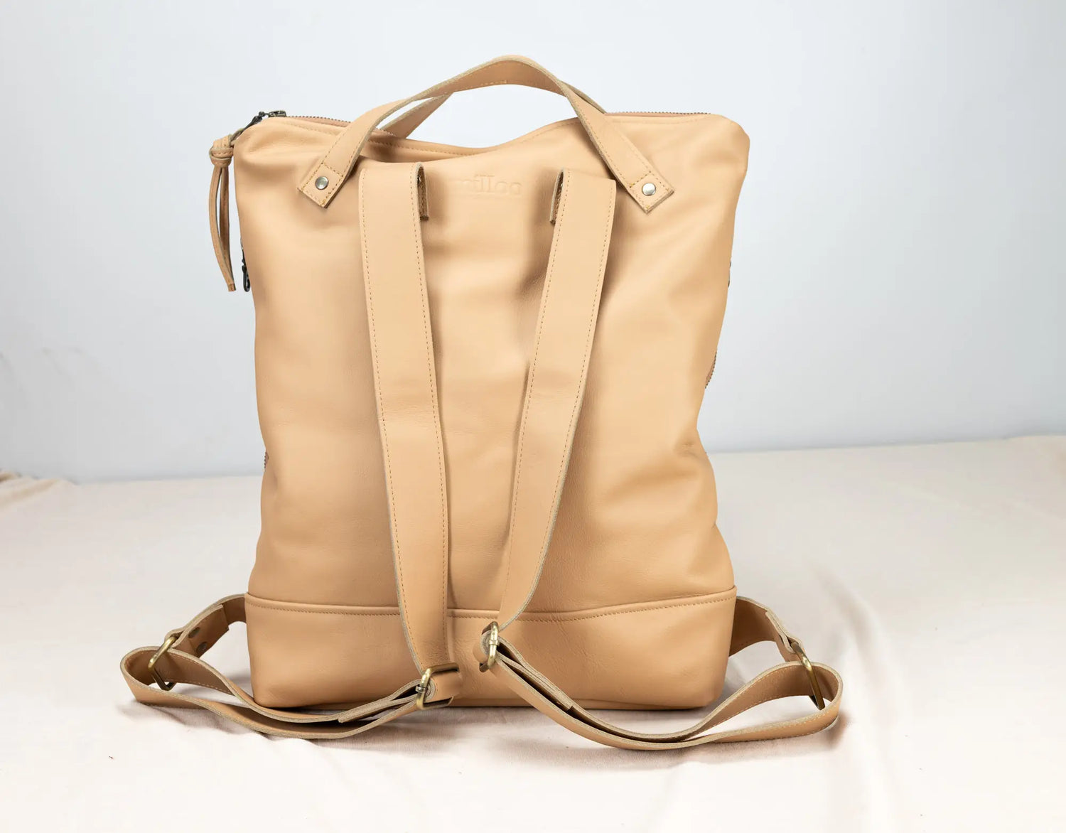 Beige backpack on a white background