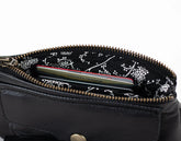 Black leather pouch with floral zipper pull on a white background