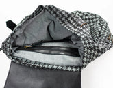 Gray backpack with houndstooth pattern on a white background